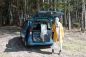 Preview: VanEssa Schlafsystem zur Kueche VW Caddy 5 Ford Tourneo Connect 3 Heckansicht mit geoeffneten Kuechenschubladen