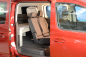 Preview: VanEssa Schlafsystem im VW Caddy 5 Maxi Ford Grand Tourneo Connect 3 Seitenansicht halbes Schlafboard aufgebaut Nutzung Sitzbank