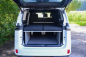 Preview: VanEssa Surfer split sleeping system as a double bed in the VW Cargo Multivan rear view
