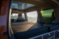 Preview: VanEssa Schlafsystem Surfer zur Kueche geteilt im VW T7 Multivan mit Einzelbettmatratzen
