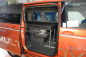 Preview: VanEssa Schlafsystem Surfer zur Kueche geteilt Doppelbett mit eingeklappten Sitzen im VW T7 Multivan