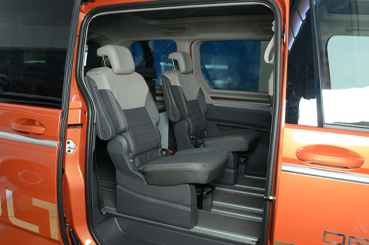 VanEssa sleeping system Van packed up in the VW T7 Multivan side view with individual seats