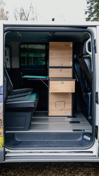 VanEssa interior module T2 with top unit open in van in graphite wild oak