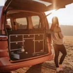 VanEssa rear kitchen carcass silver front black matt in VW T7 Multivan with sunrise