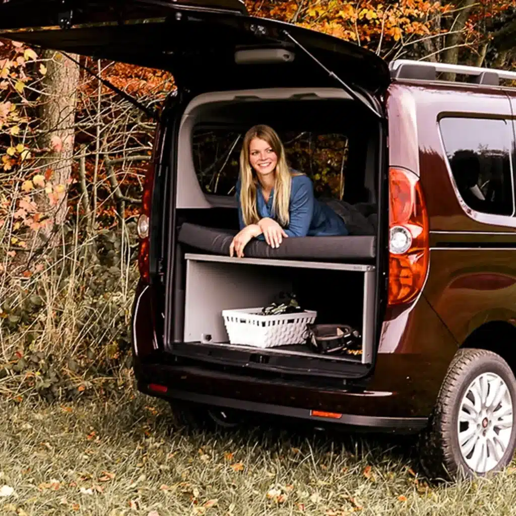 Doblo Combo sleeping system at the edge of the forest