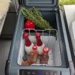 Dometic CFX2 28 cool box in VanEssa ARCO system from above with decoration