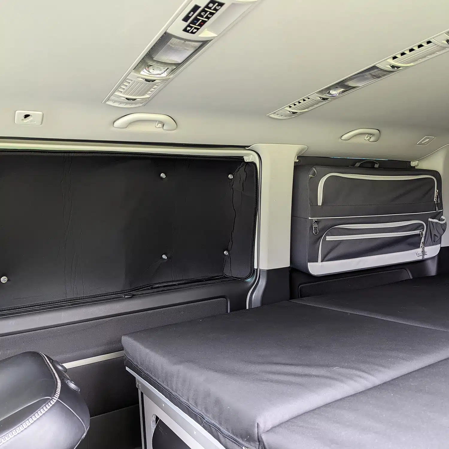 Black Edition VW T5 T6 T6.1 rear window thermal mats in combination with pannier bag