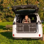 VanEssa rear kitchen in VW ID. Buzz under tree