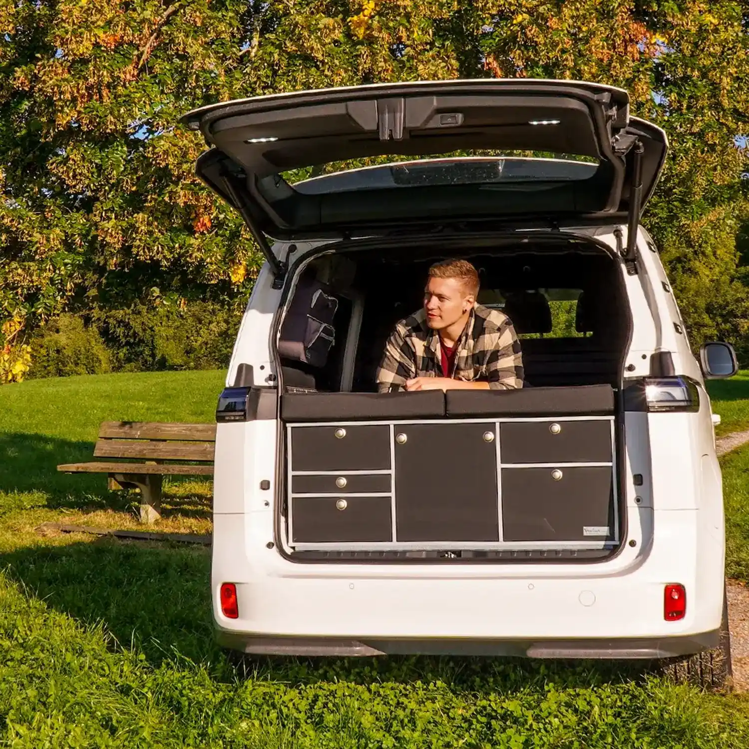 VanEssa rear kitchen in VW ID. Buzz under tree